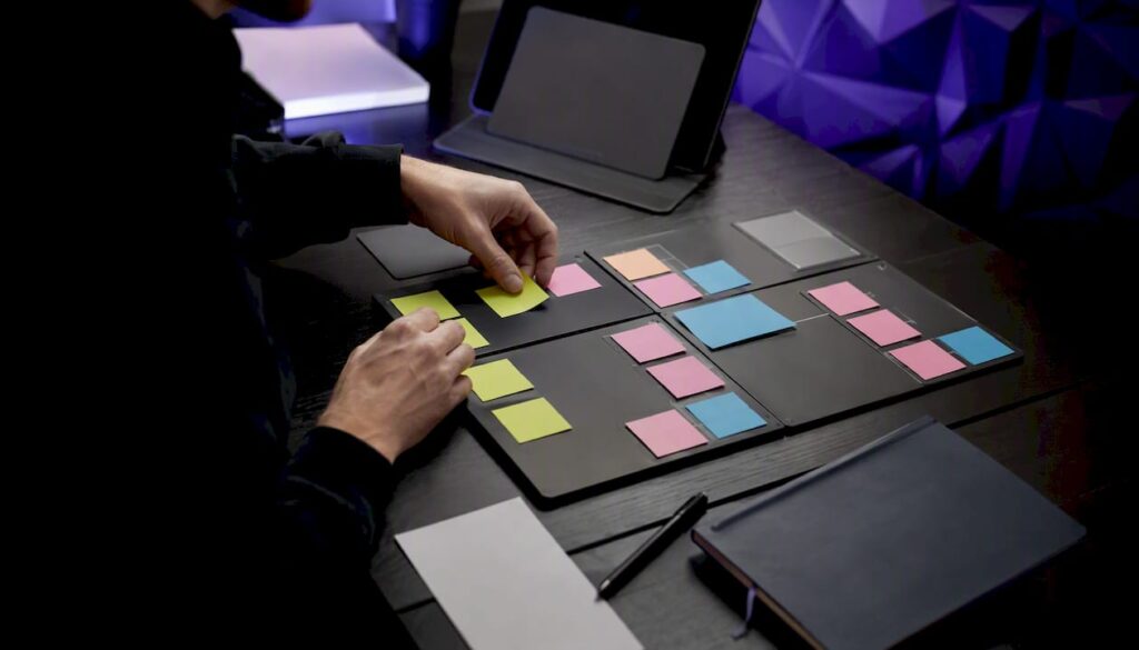 Hands arranging conversation design flowcharts