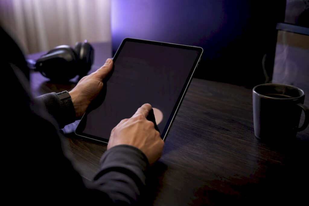 Hands reviewing transcripts and audio files