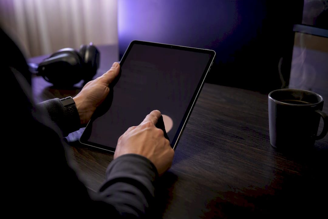 Hands reviewing transcripts and audio files