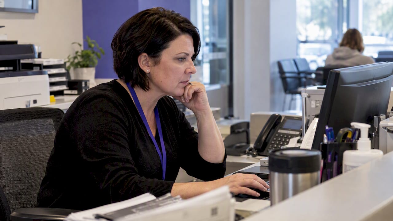 Clinic manager reviewing upcoming patient appointments