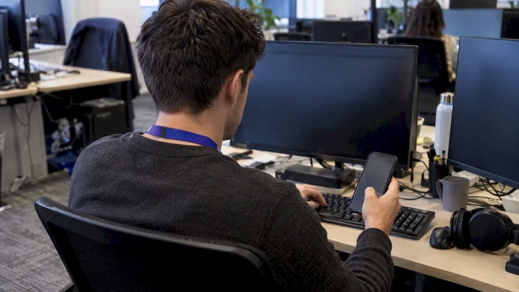 Employee completing a password reset at work
