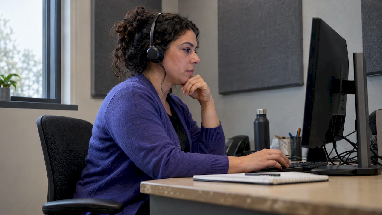 Analyst reviewing a customer service call